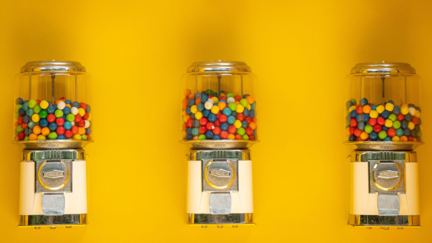 2HBT2XC Gumball Vending Machines against a Yellow Wall