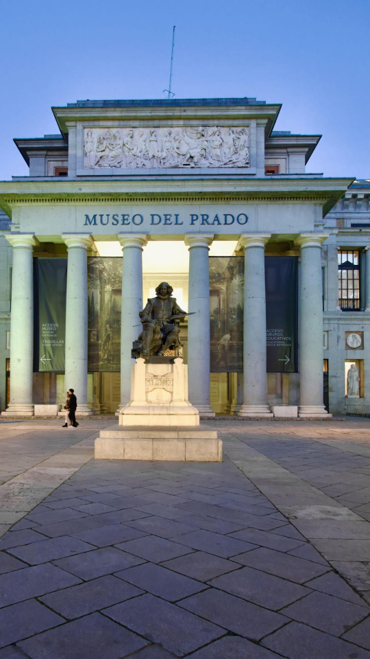 2SM0D2E Spain's national art museum the Museo del Prado with a statue of Diego Velazquez in evening light in the city centre Paseo del Prado Madrid Spain